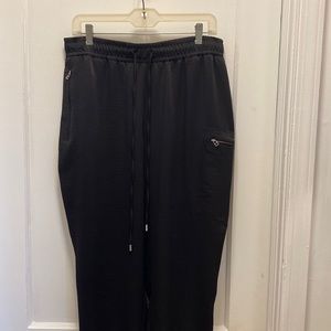 Jennifer Lopez satin joggers.